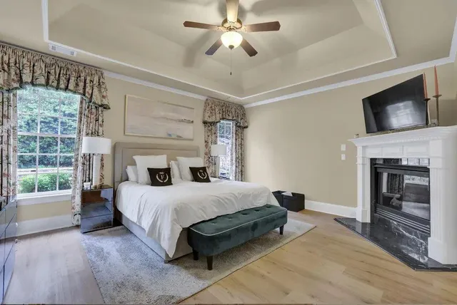 a bedroom with a bed and a fireplace