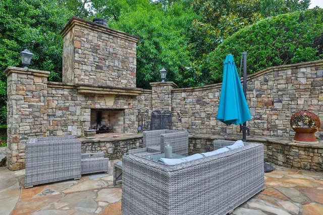 a shelf with water and white cabinets