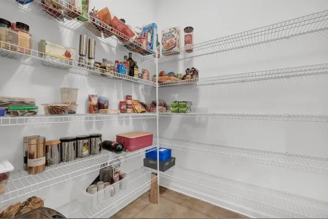 a view of a house with swimming pool and sitting area