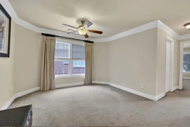 a view of a hallway with windows