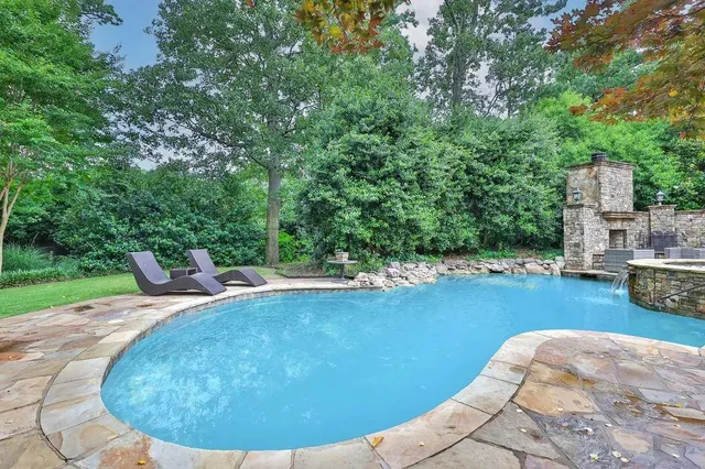 a view of a swimming pool with an outdoor space