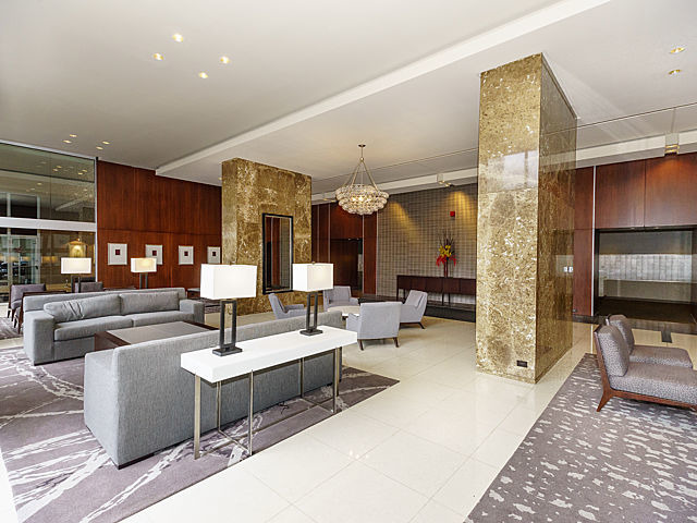 655 West Irving Park Road, Unit 1114 Chicago, IL 60613 - Photo 11 of 14 a living room with furniture and a flat screen tv