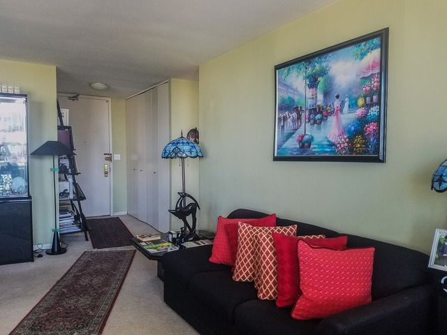 655 West Irving Park Road, Unit 1114 Chicago, IL 60613 - Photo 4 of 14 a bedroom with furniture and a bed