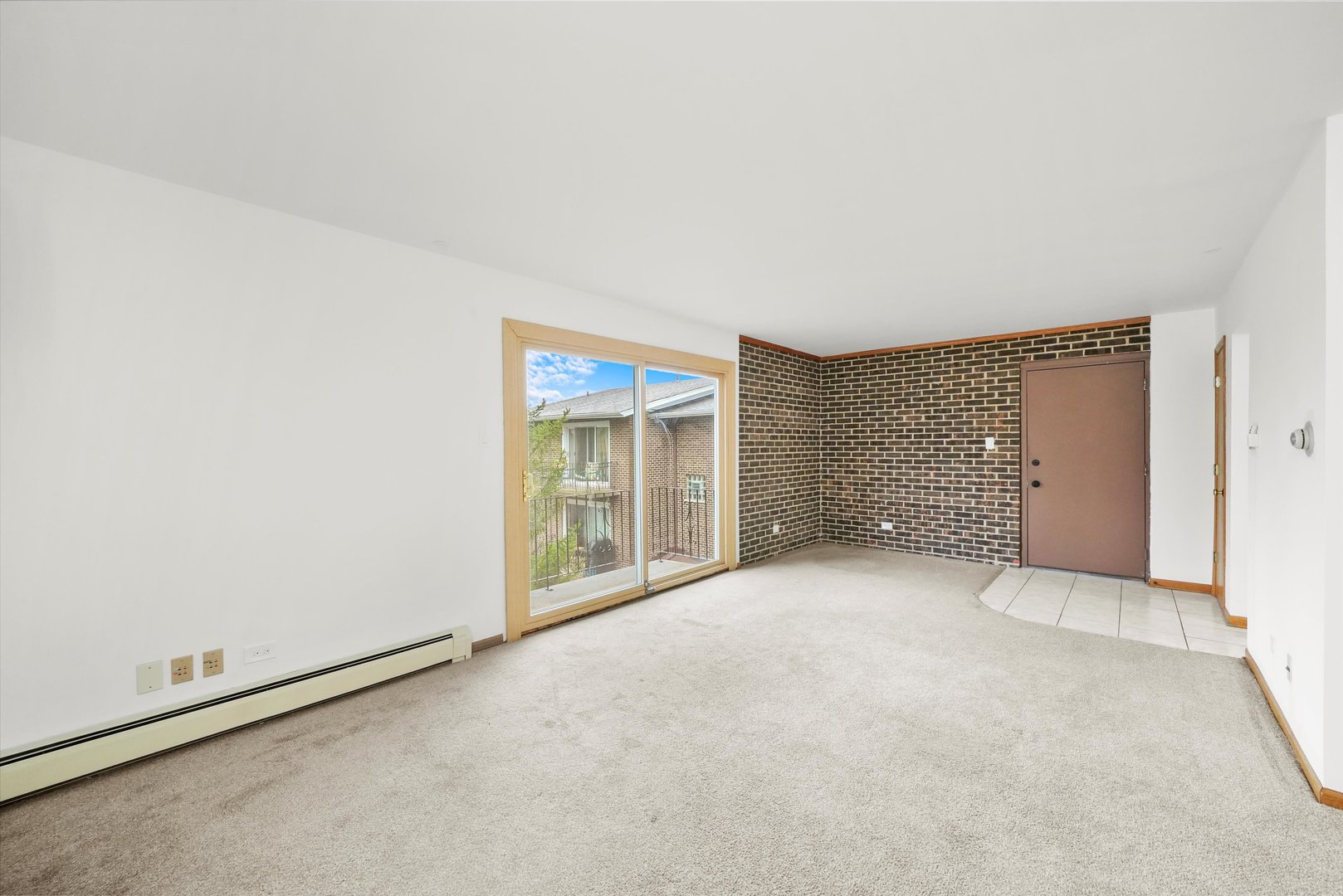 9016 West 140th Street, Unit 3A Orland Park, IL 60462 - Photo 3 of 25 a view of an empty room with a window