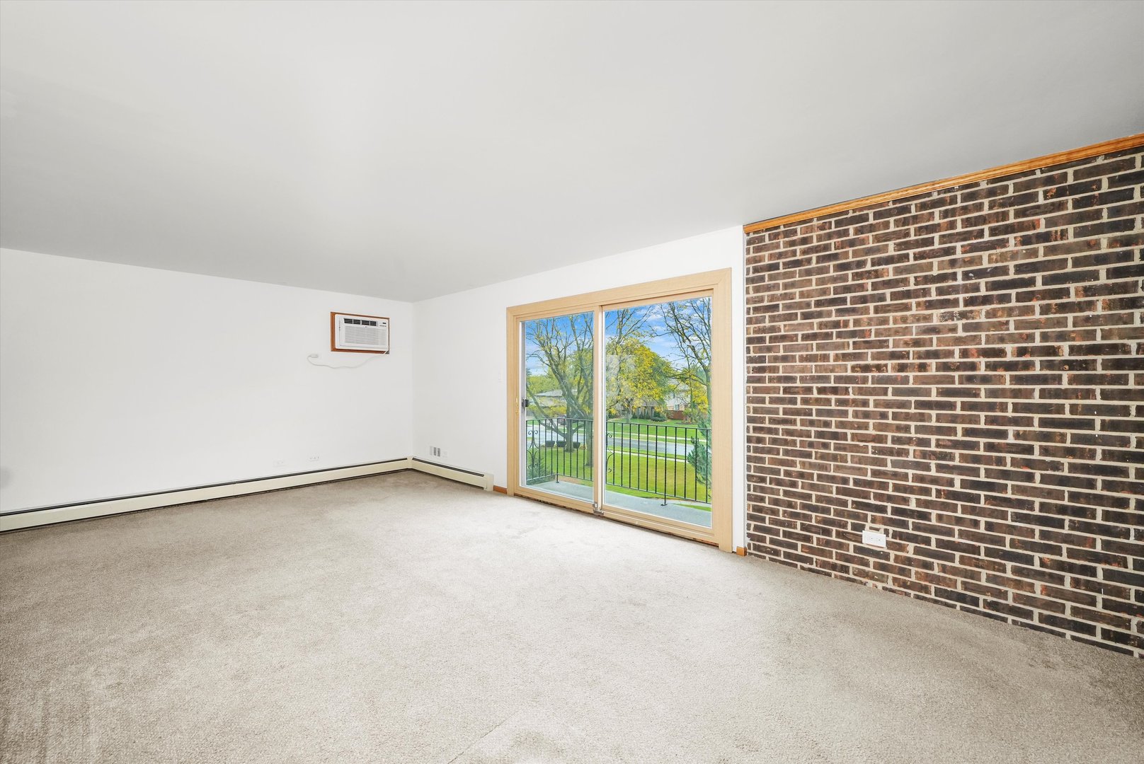 9016 West 140th Street, Unit 3A Orland Park, IL 60462 - Photo 4 of 25 a view of an empty room with windows