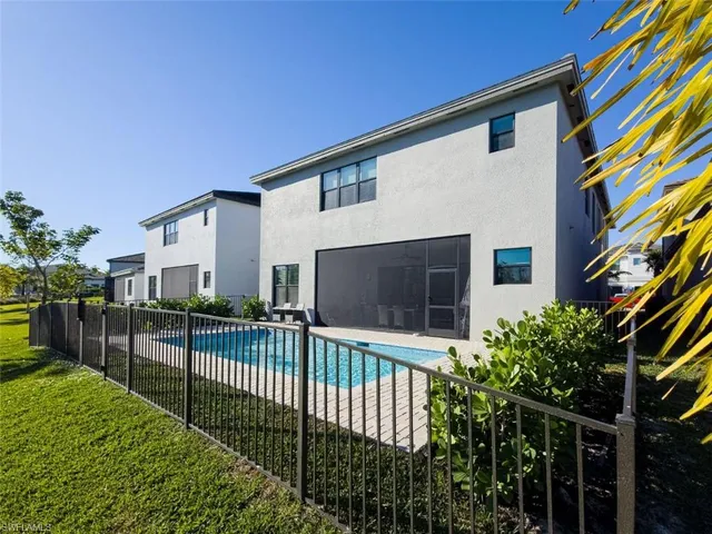 a view of a house with a small yard and plants