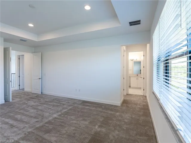a bathroom with a toilet sink and shower