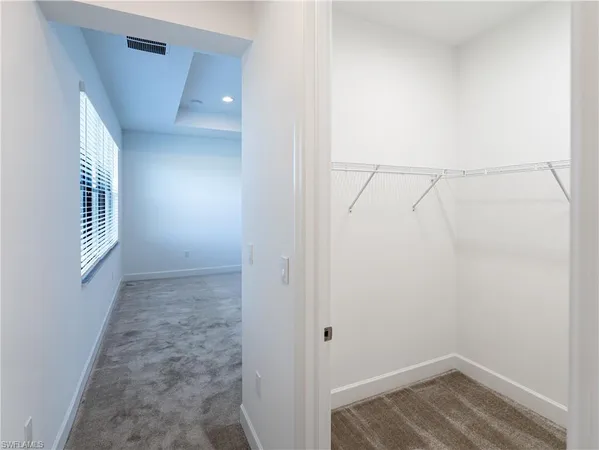 a view of a house with a swimming pool and yard