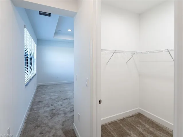 a view of a house with a swimming pool and yard