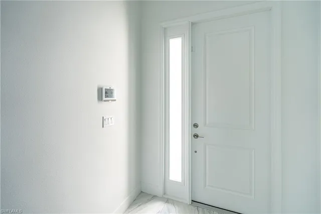 a view of a bathroom with white door