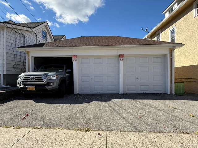 a car parked in front of a house