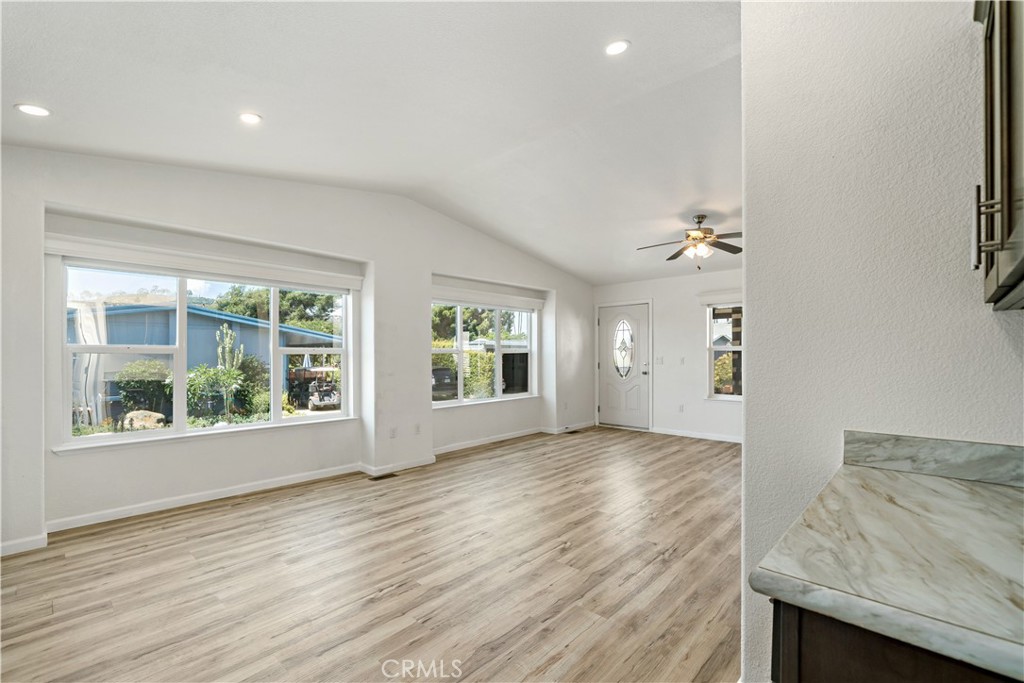 4650 Dulin Road, Unit 39 Fallbrook, CA 92003 - Photo 11 of 39 an empty room with wooden floor and windows