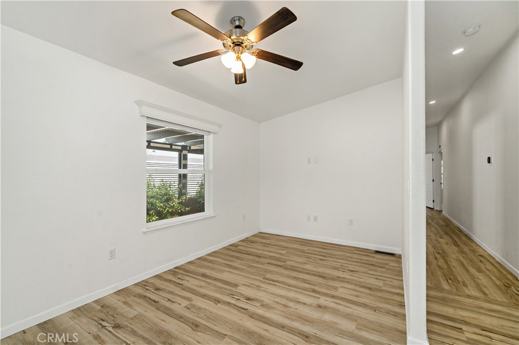 4650 Dulin Road, Unit 39 Fallbrook, CA 92003 - Photo 12 of 39 an empty room with a window and a ceiling fan