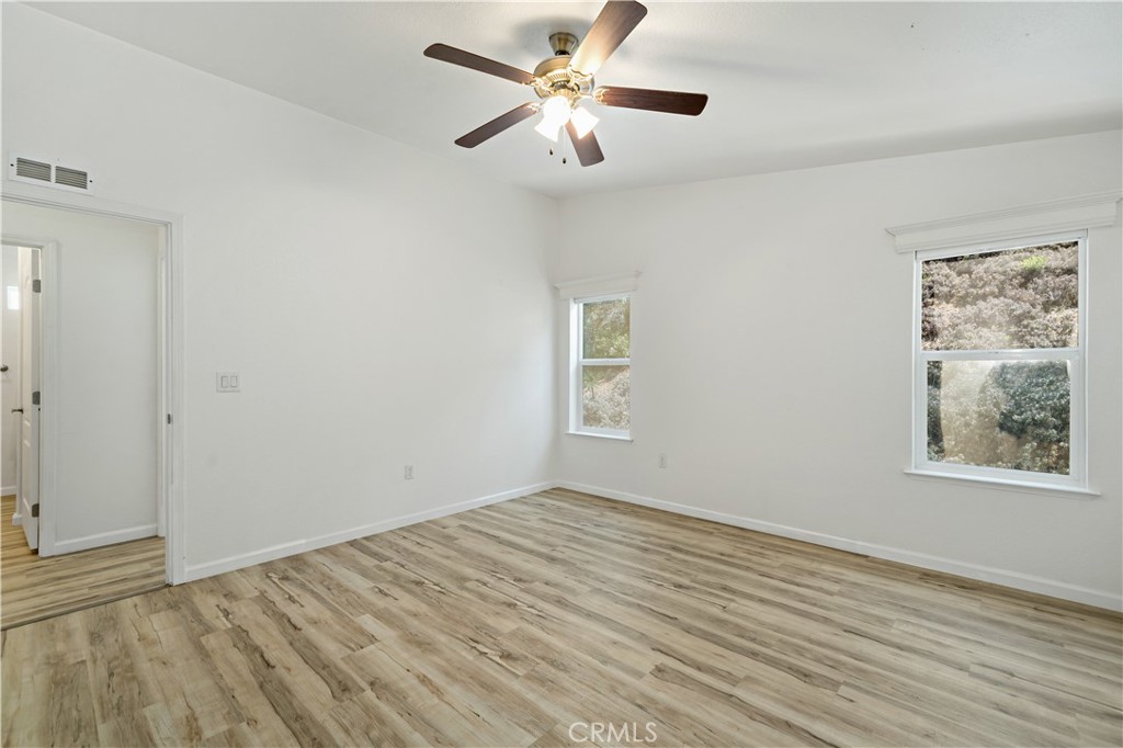 4650 Dulin Road, Unit 39 Fallbrook, CA 92003 - Photo 17 of 39 wooden floor in an empty room with a window