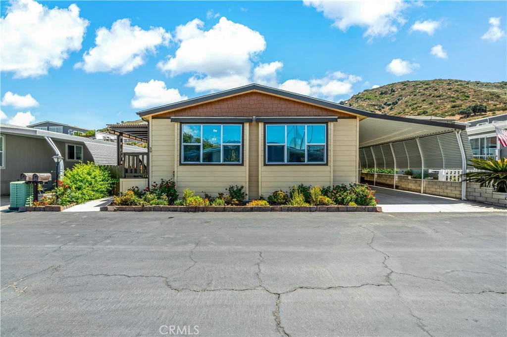 4650 Dulin Road, Unit 39 Fallbrook, CA 92003 - Photo 2 of 39 a front view of a house with garden