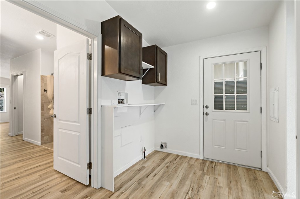 4650 Dulin Road, Unit 39 Fallbrook, CA 92003 - Photo 24 of 39 a view of hallway with wooden floor and stairs