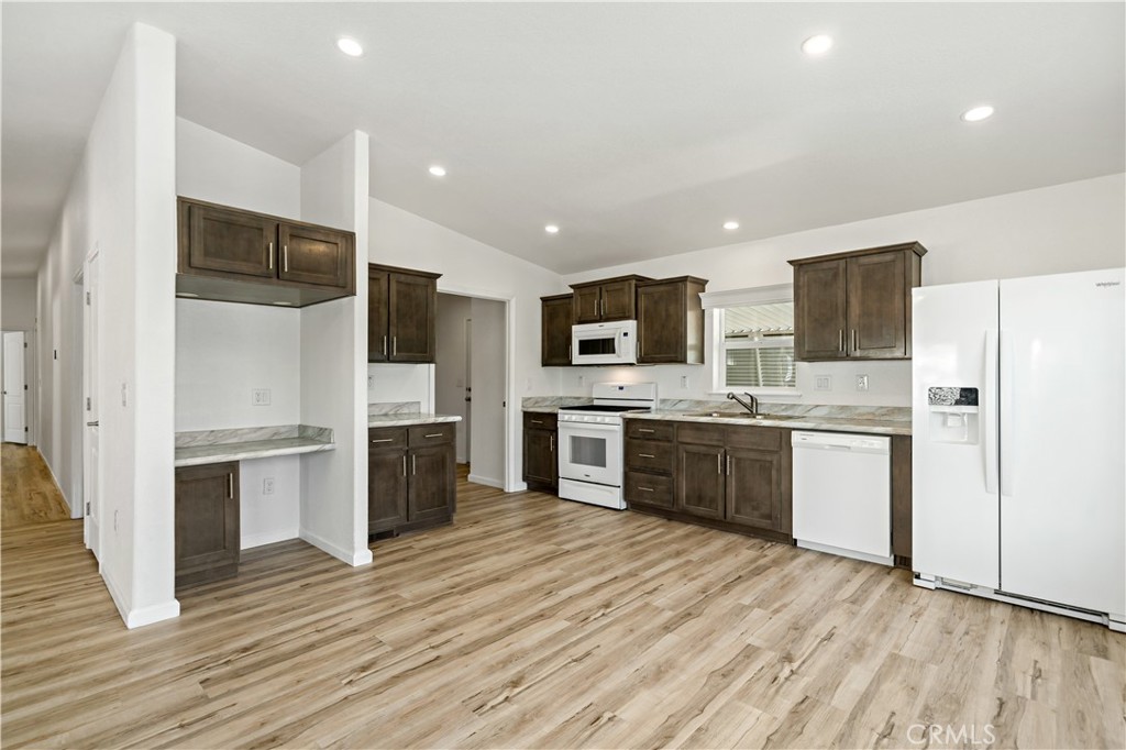 4650 Dulin Road, Unit 39 Fallbrook, CA 92003 - Photo 5 of 39 a kitchen with stainless steel appliances a refrigerator sink and microwave