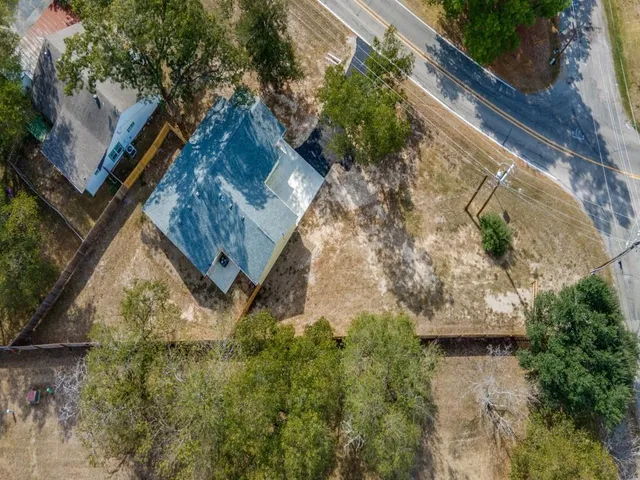 a aerial view of a house with a yard
