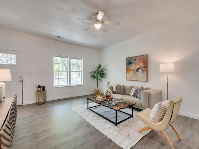 a living room with furniture and a window