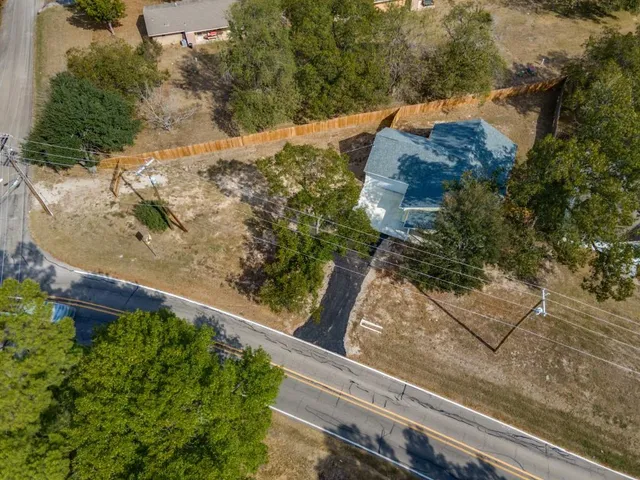 a aerial view of a house with a yard