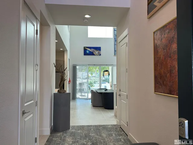 a workspace with kitchen area and glass door