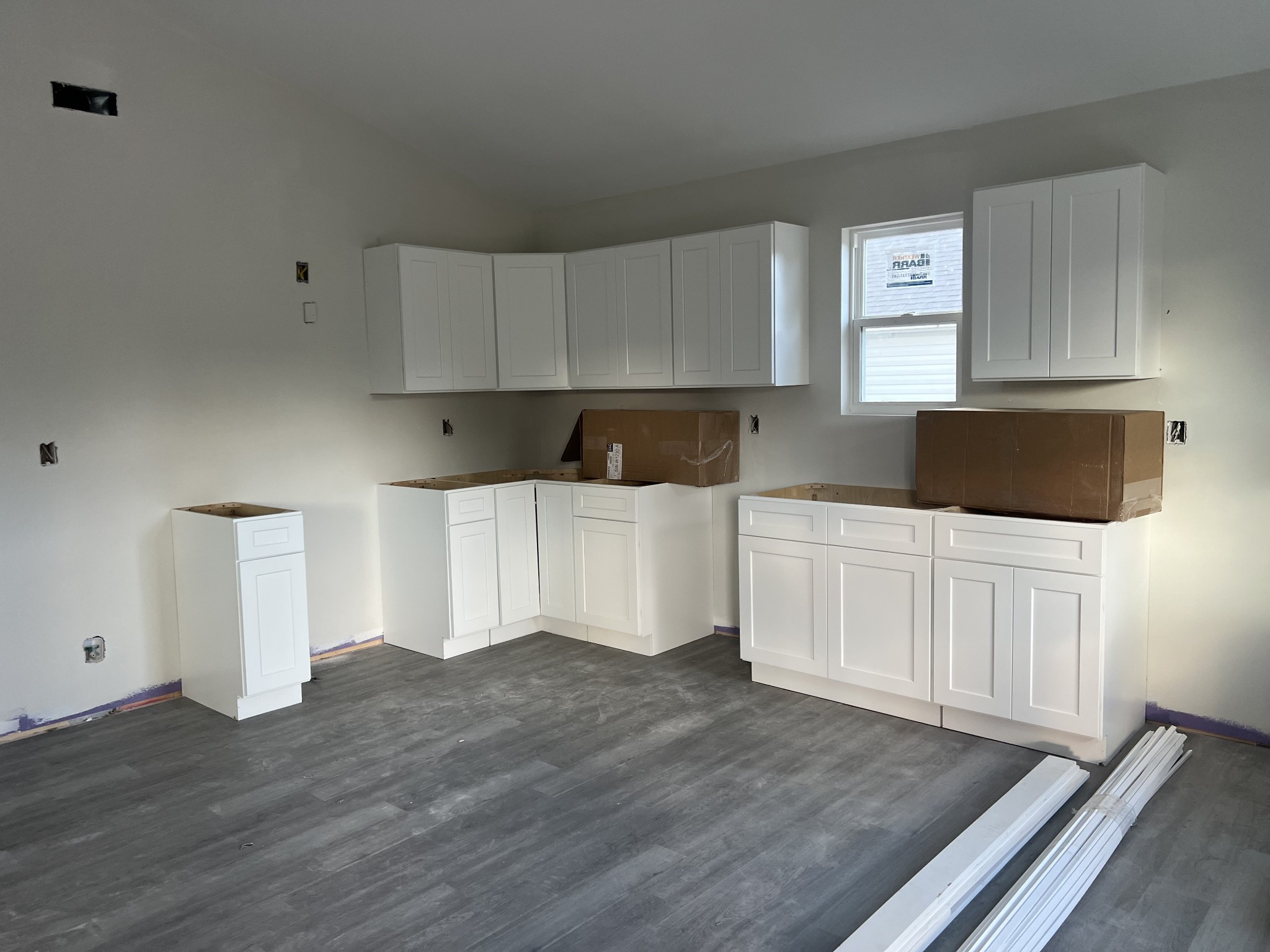 709 Hunt Street Winchester, TN 37398 - Photo 2 of 6 a kitchen with a white cabinets and wooden floor