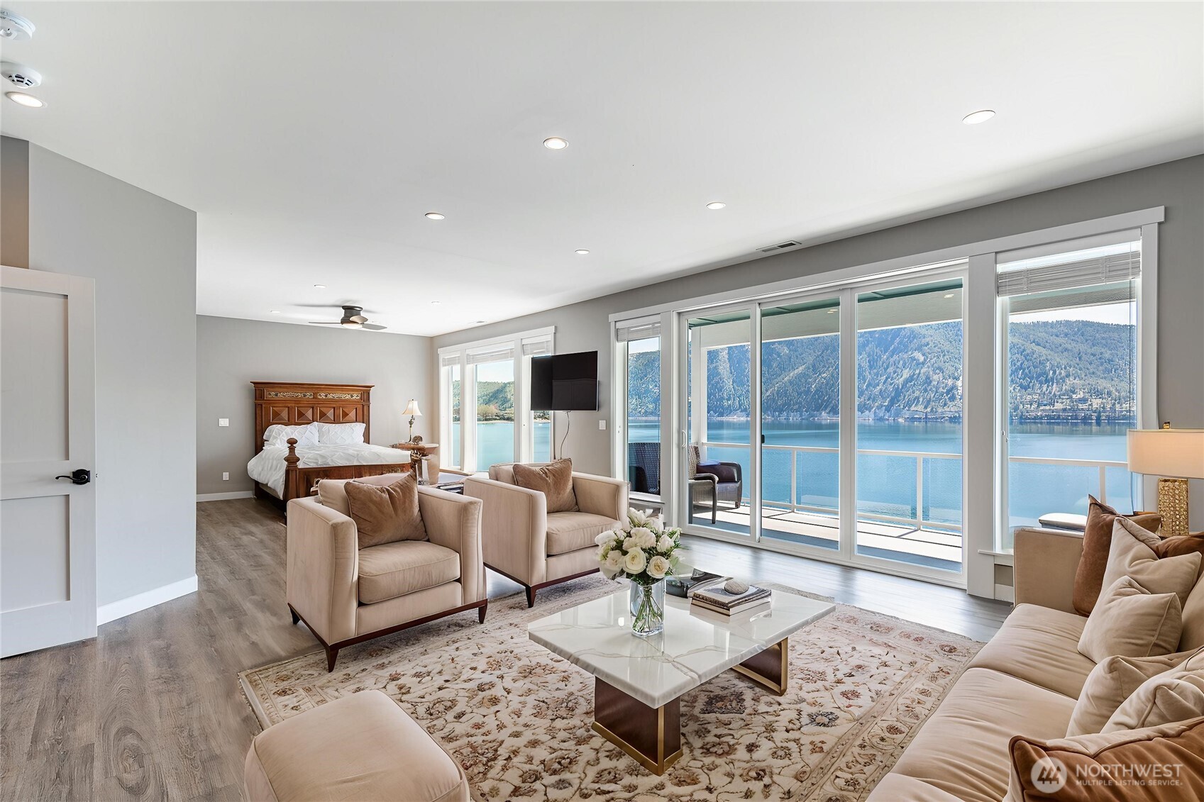 665 Manson Boulevard Manson, WA 98831 - Photo 12 of 39 a living room with furniture and a large window