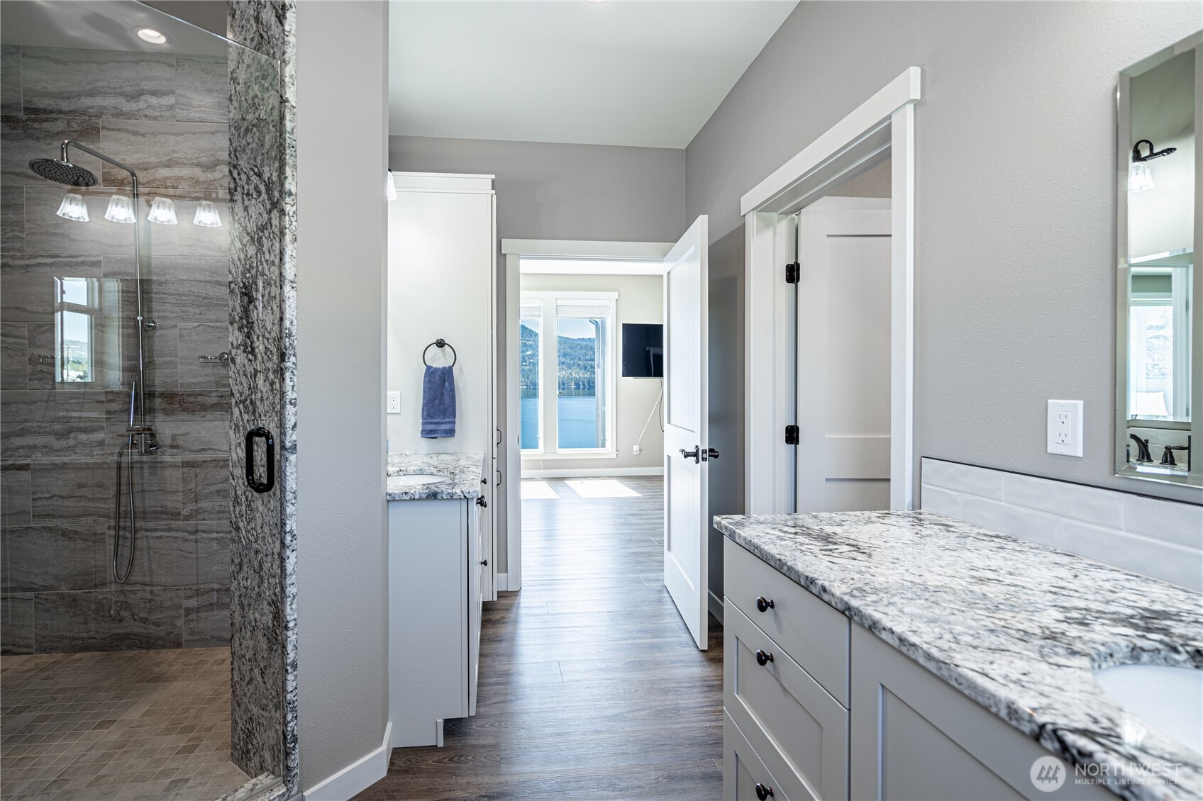 665 Manson Boulevard Manson, WA 98831 - Photo 13 of 39 a bathroom with a granite countertop sink and shower