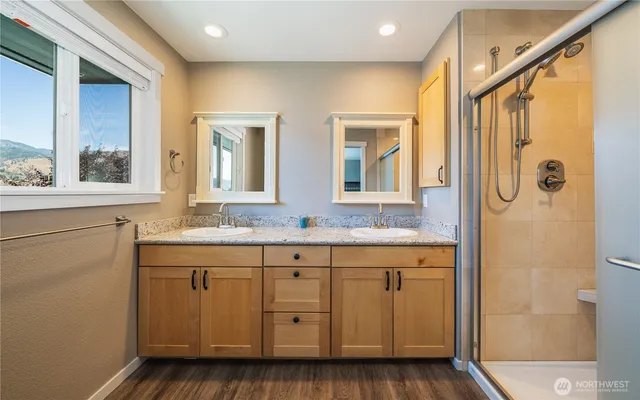 a view of a livingroom with furniture and hardwood floor