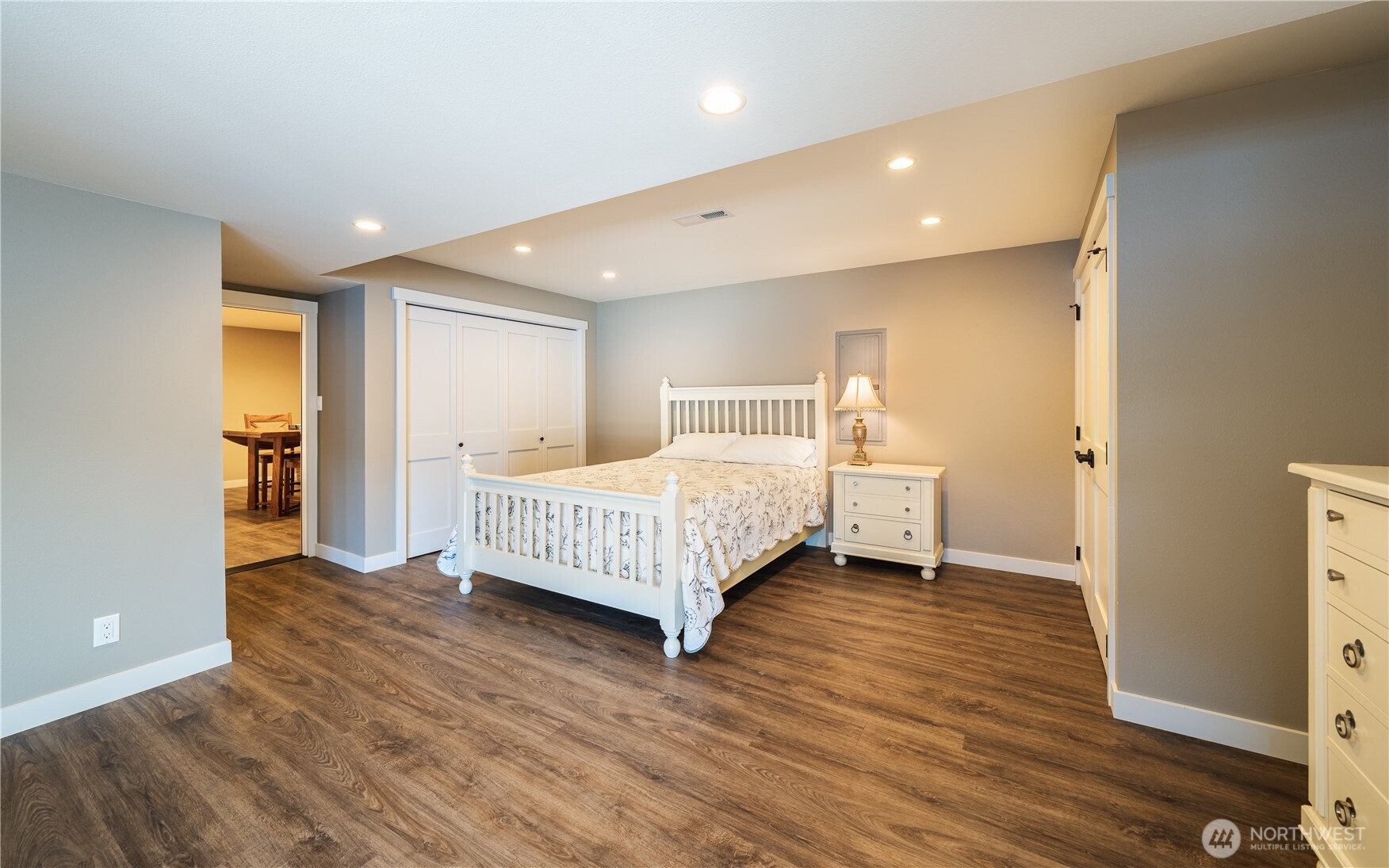 665 Manson Boulevard Manson, WA 98831 - Photo 20 of 39 a bedroom with a bed and a night stand