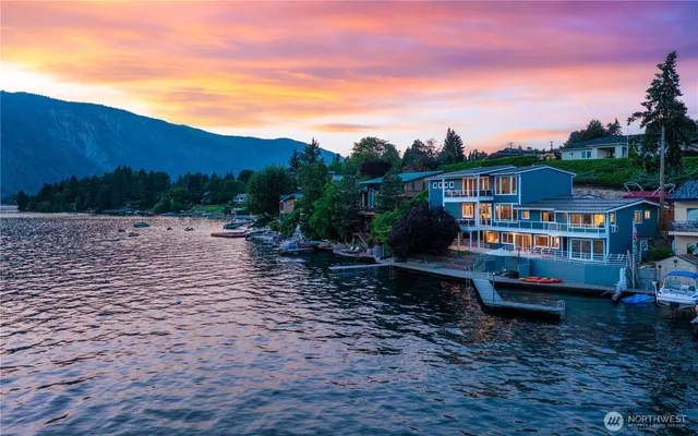 a view of a lake with a house in the background