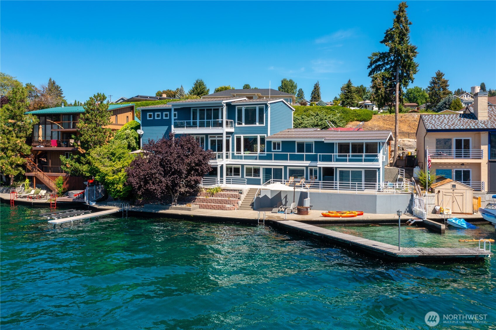 665 Manson Boulevard Manson, WA 98831 - Photo 23 of 39 a view of a house with a garden and sitting area