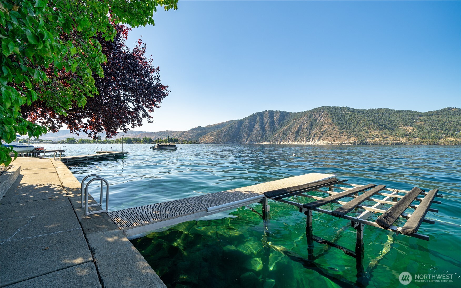 665 Manson Boulevard Manson, WA 98831 - Photo 28 of 39 a view of a lake with a mountain