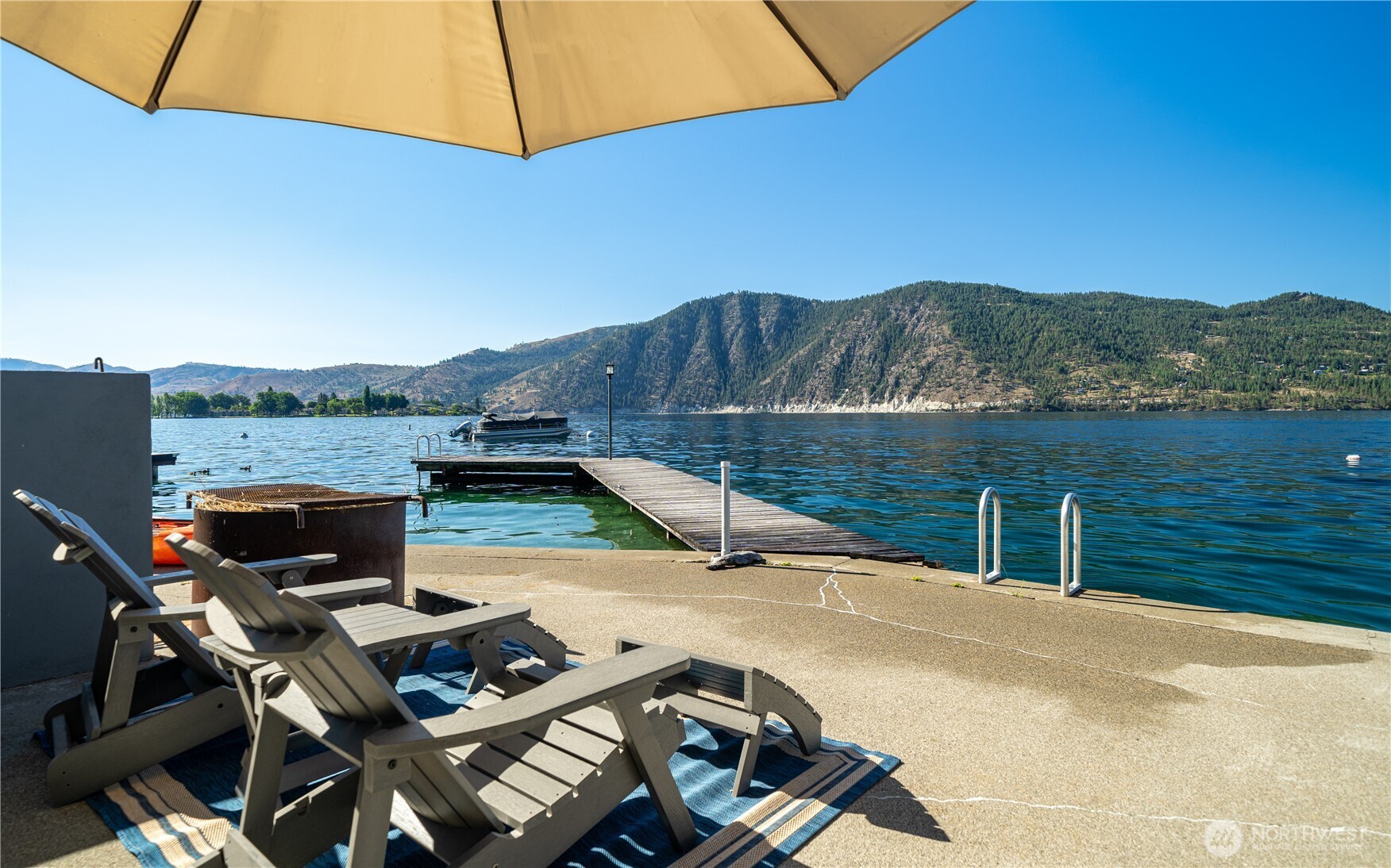665 Manson Boulevard Manson, WA 98831 - Photo 39 of 39 a view of a patio with wooden floor and a lake view