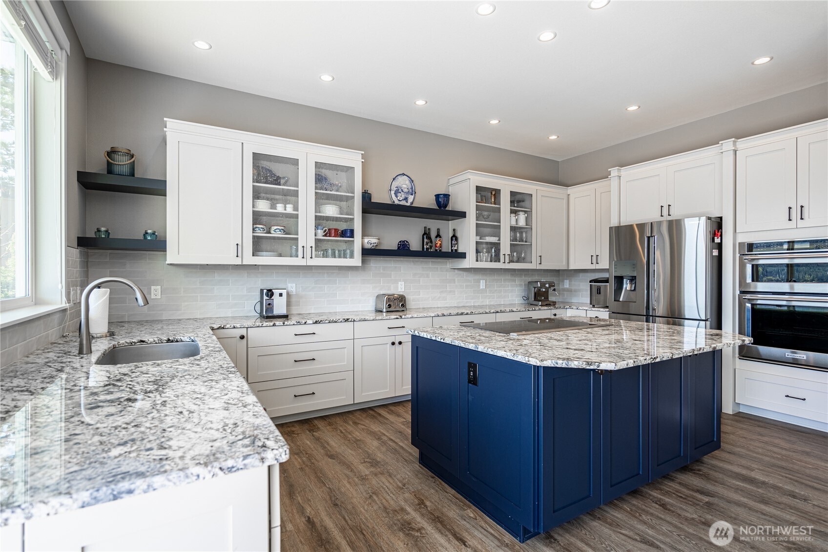 665 Manson Boulevard Manson, WA 98831 - Photo 4 of 39 a kitchen with stainless steel appliances granite countertop a sink stove and refrigerator