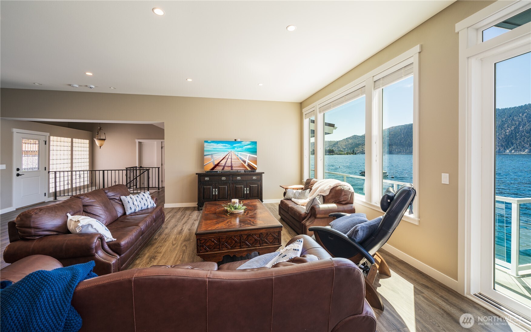 665 Manson Boulevard Manson, WA 98831 - Photo 6 of 39 a living room with furniture and a floor to ceiling window