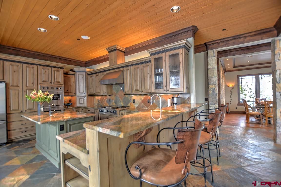 302 Maverick Lane Montrose, CO 81403 - Photo 12 of 35 a dinning area with furniture and wooden floor