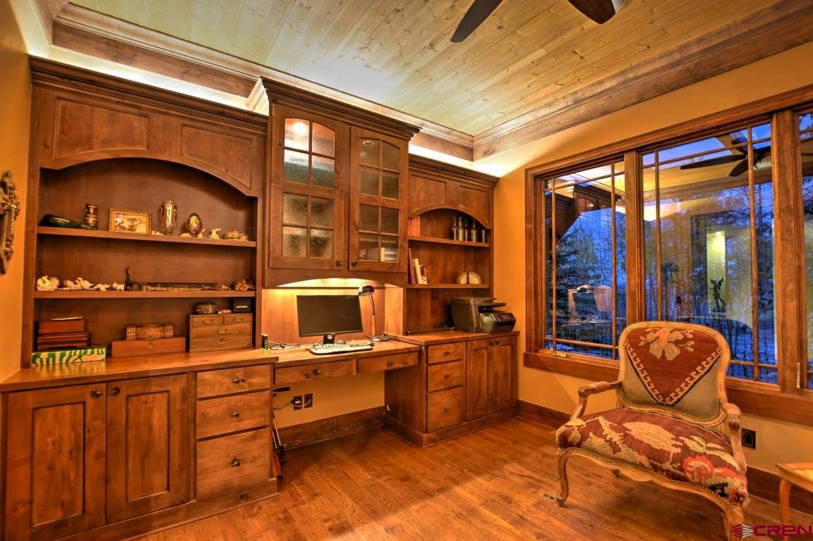 302 Maverick Lane Montrose, CO 81403 - Photo 14 of 35 a room with furniture a rug and a window