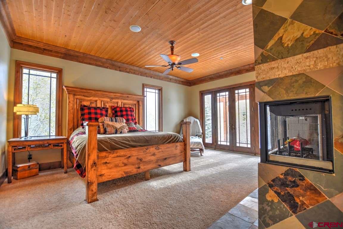 302 Maverick Lane Montrose, CO 81403 - Photo 17 of 35 a bedroom with furniture and a window