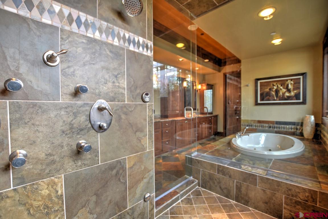 302 Maverick Lane Montrose, CO 81403 - Photo 20 of 35 a bathroom with a sink and a mirror