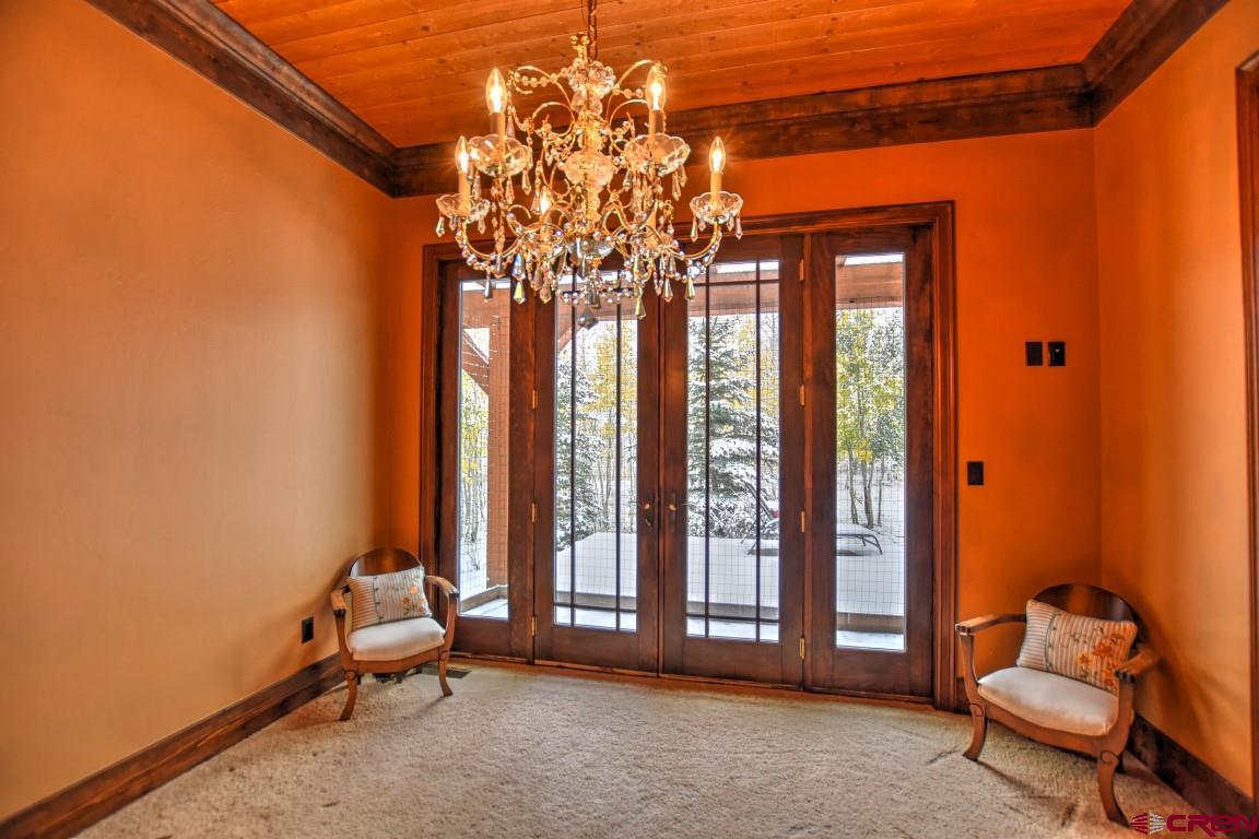 302 Maverick Lane Montrose, CO 81403 - Photo 21 of 35 a living room with furniture and a large window