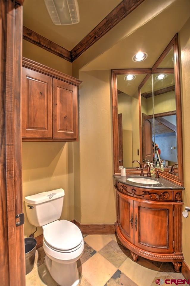 302 Maverick Lane Montrose, CO 81403 - Photo 27 of 35 a bathroom with a toilet sink and mirror