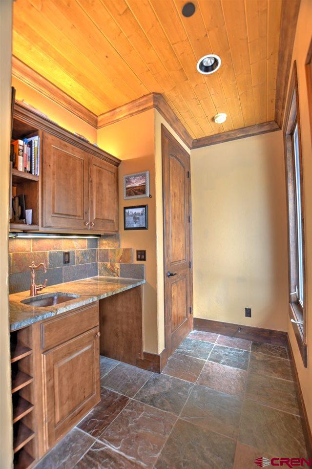 302 Maverick Lane Montrose, CO 81403 - Photo 30 of 35 a kitchen with a sink and cabinets