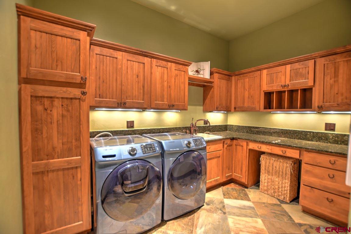 302 Maverick Lane Montrose, CO 81403 - Photo 33 of 35 a kitchen with stainless steel appliances granite countertop a sink and cabinets