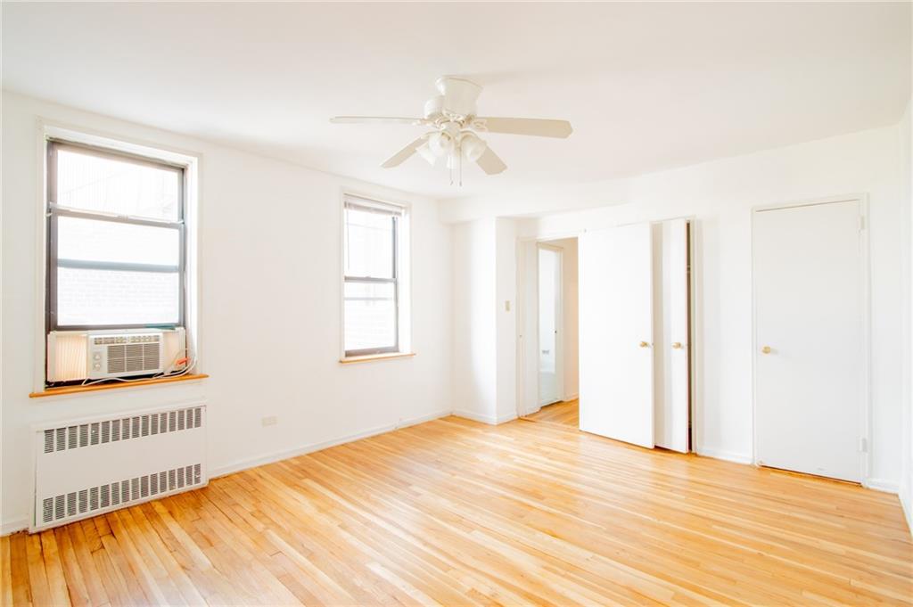 7259 Shore Road, Unit 6G Brooklyn, NY 11209 - Photo 15 of 30 a bedroom with a bed and a window