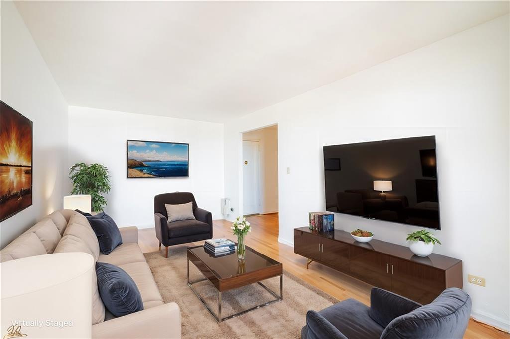 7259 Shore Road, Unit 6G Brooklyn, NY 11209 - Photo 17 of 30 a living room with furniture and a flat screen tv