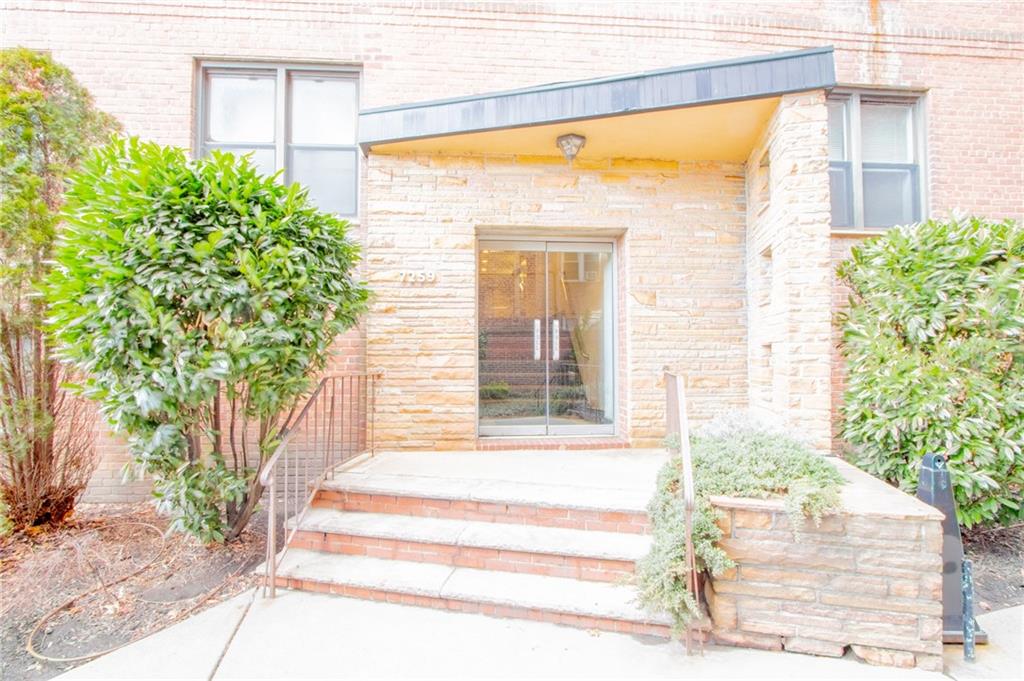 7259 Shore Road, Unit 6G Brooklyn, NY 11209 - Photo 24 of 30 a front view of a house with a outdoor space