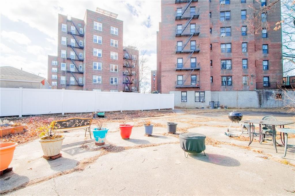 7259 Shore Road, Unit 6G Brooklyn, NY 11209 - Photo 27 of 30 a swimming pool with outdoor seating and barbeque oven