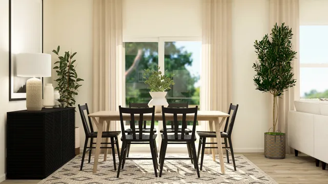 a view of a dining room with furniture and window