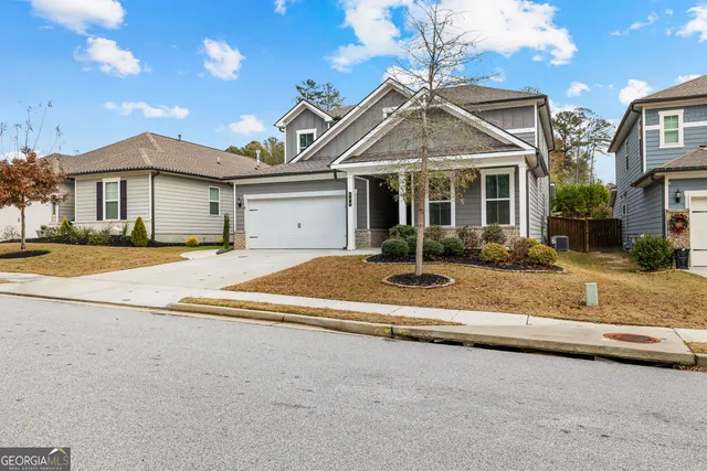a view of front door with couch and chairs